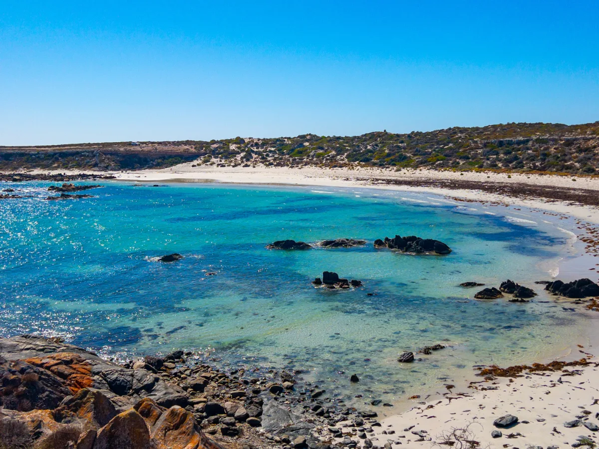 A secluded bay near Corny Point, offering a tranquil escape from the rugged coastal landscape.