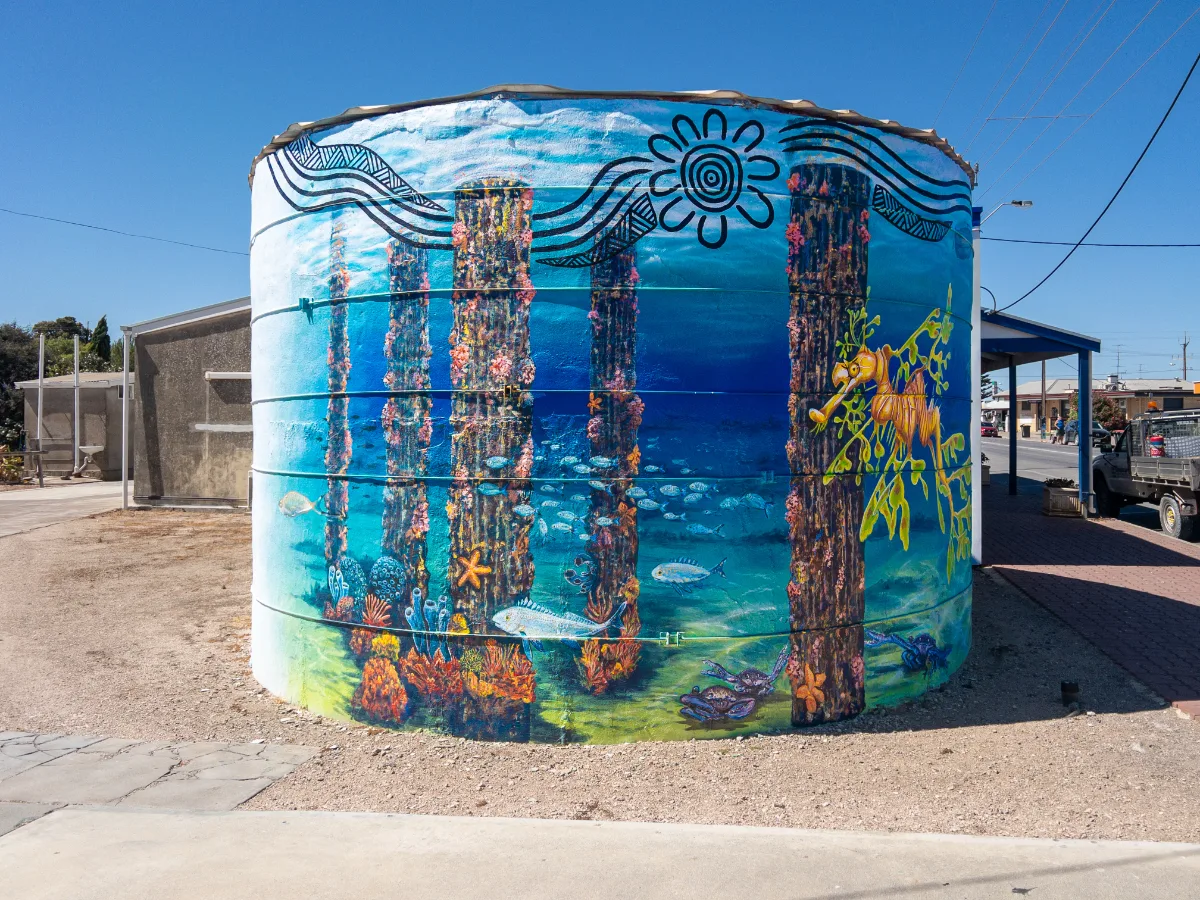 A water tank in Warooka transformed into an underwater vista, complete with marine life and the remnants of a pier.