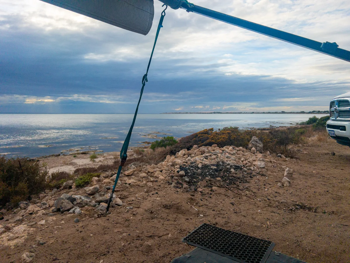 Awning out, the sky darkens over the rocky coastline at Point Souttar. A change is coming.