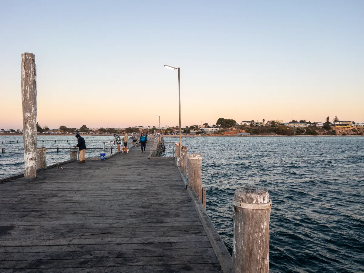 The Moonta Bay jetty, a hub of activity by day, becomes a serene spot for sunset viewing.