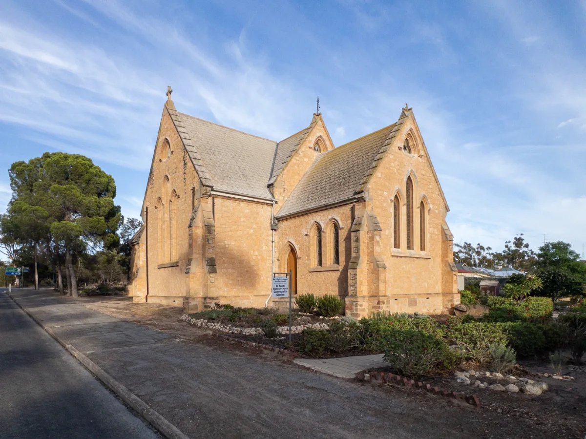 The equally impressive side view of the church, complemented by its meticulously kept gardens.