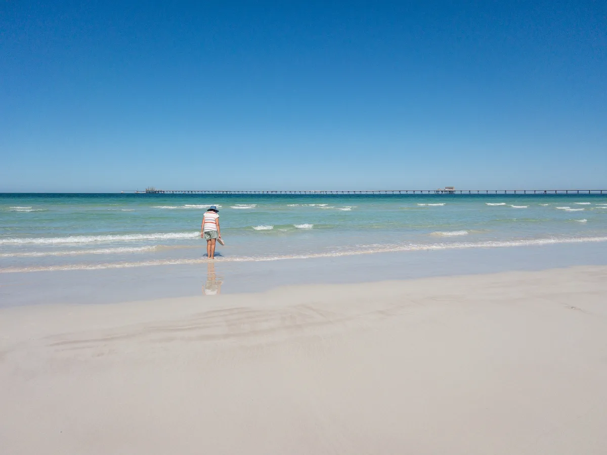 Lisa enjoying the cool, shallow waters off the beach at Point Lowly.