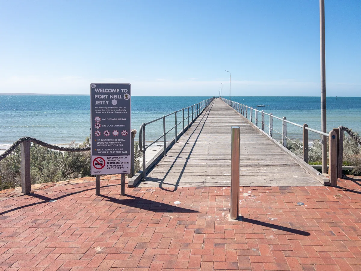 The Port Neill jetty extends far into the calm waters of the Spencer Gulf.