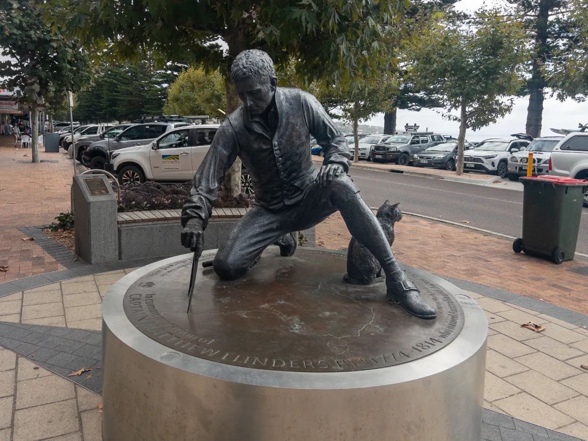 The statue of Captain Matthew Flinders, kneeling with his chart and accompanied by his cat Trim, provides a tangible link to the early days of Australian exploration in Port Lincoln.