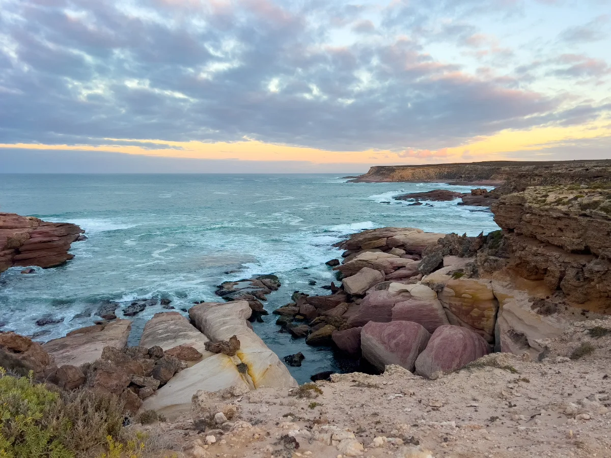 Rugged coastline of the District Council of Elliston awash in the light of the rising sun.