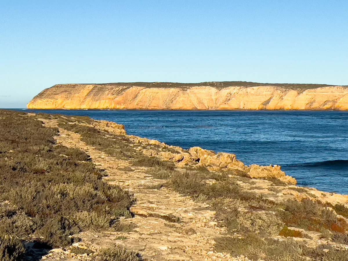 Rugged cliffs meet the turquoise sea at Venus Bay.