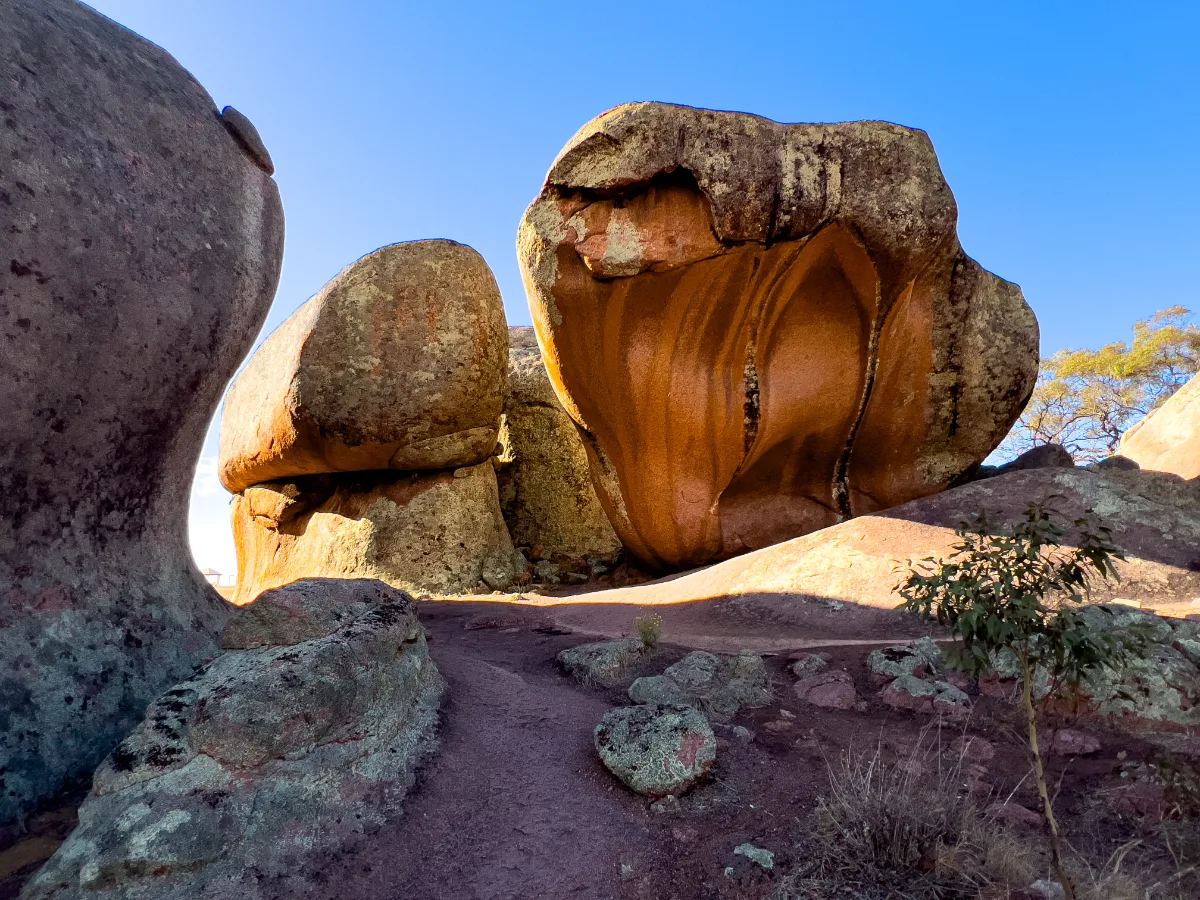 A footpath winds its way through Murphy's Haystacks, inviting exploration of these unusual geological wonders.