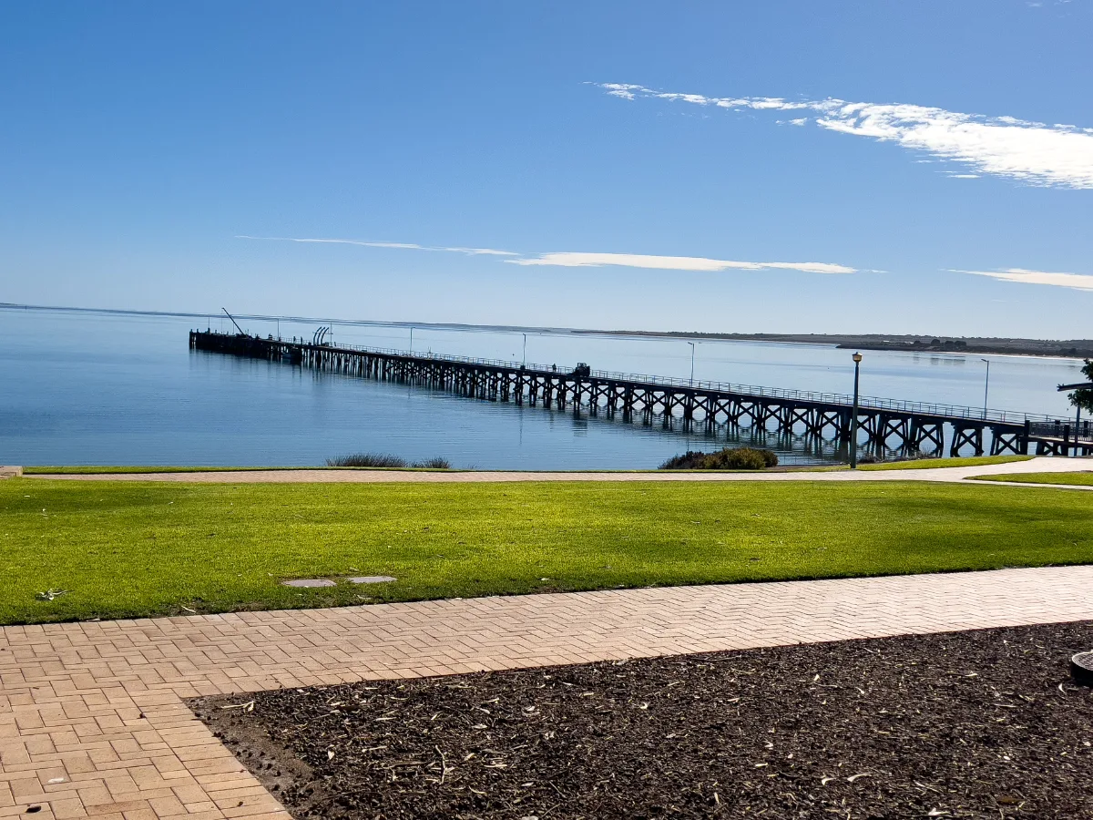 The historic Streaky Bay Jetty extending into the tranquil waters of the bay.