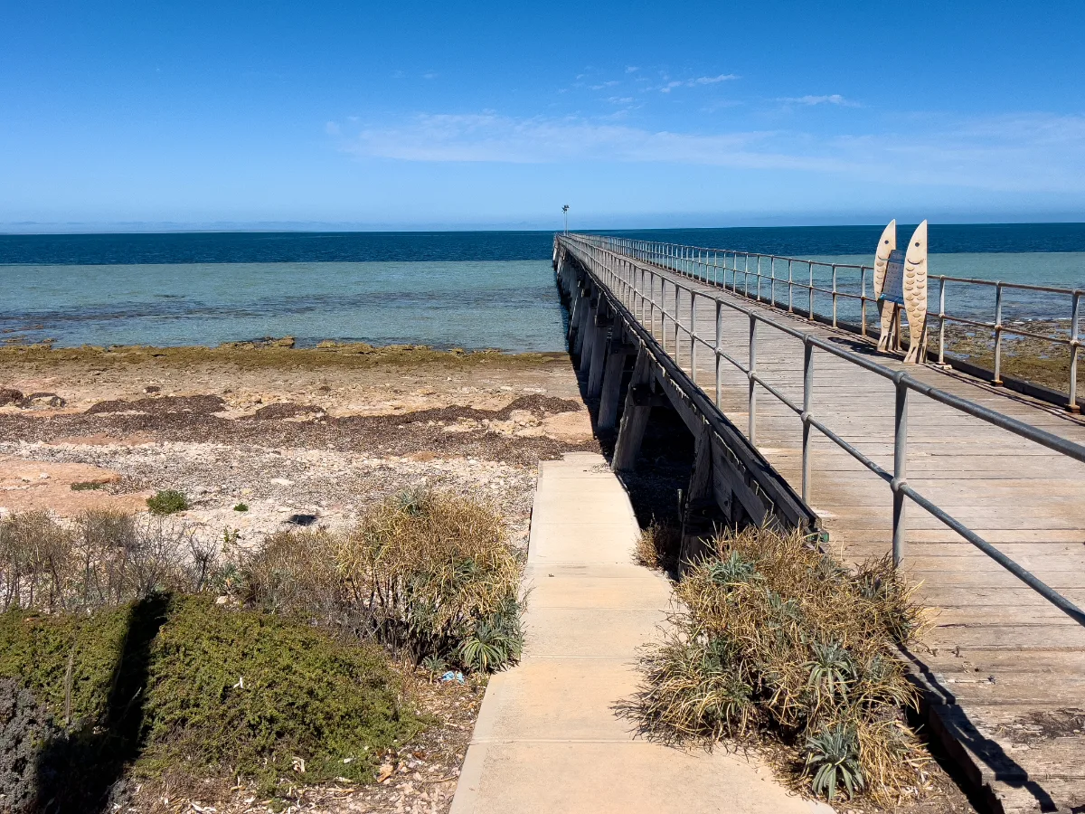 The long jetty at Haslam stretches out into the turquoise waters, providing a tranquil escape.