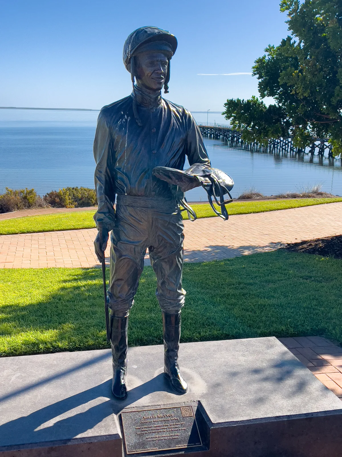 The bronze statue of champion jockey Kerrin McEvoy stands proudly overlooking the water.