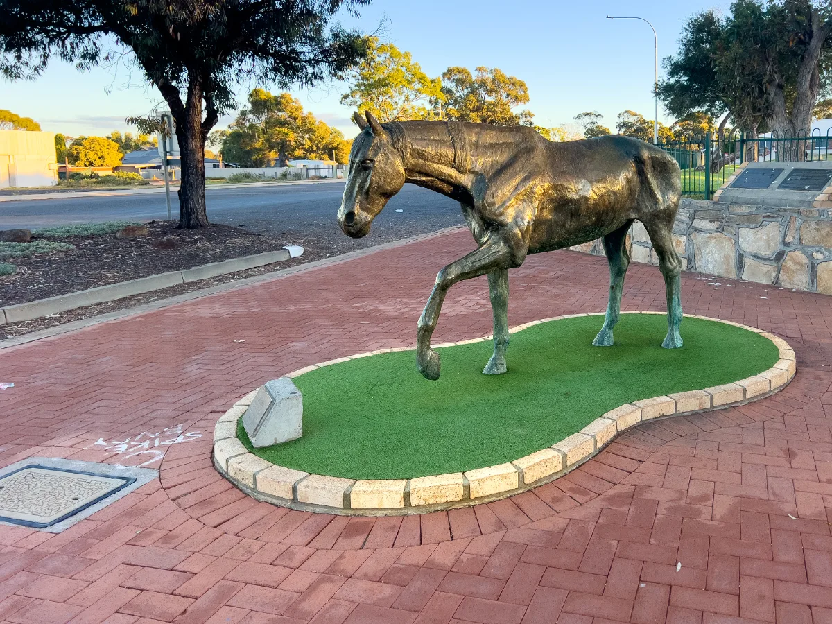 A bronze horse statue adds a touch of whimsy to the streets of Norseman.