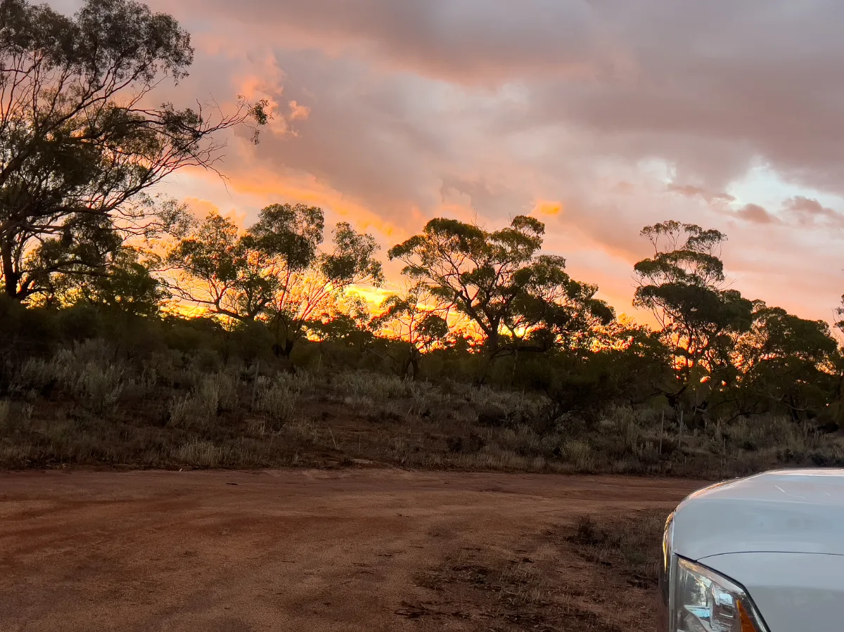 Fiery sunset over the Western Australian bushland at Nungarin's Eaglestone Rock.