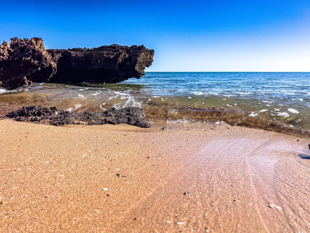 Volcanic rocks meet pristine coastal waters