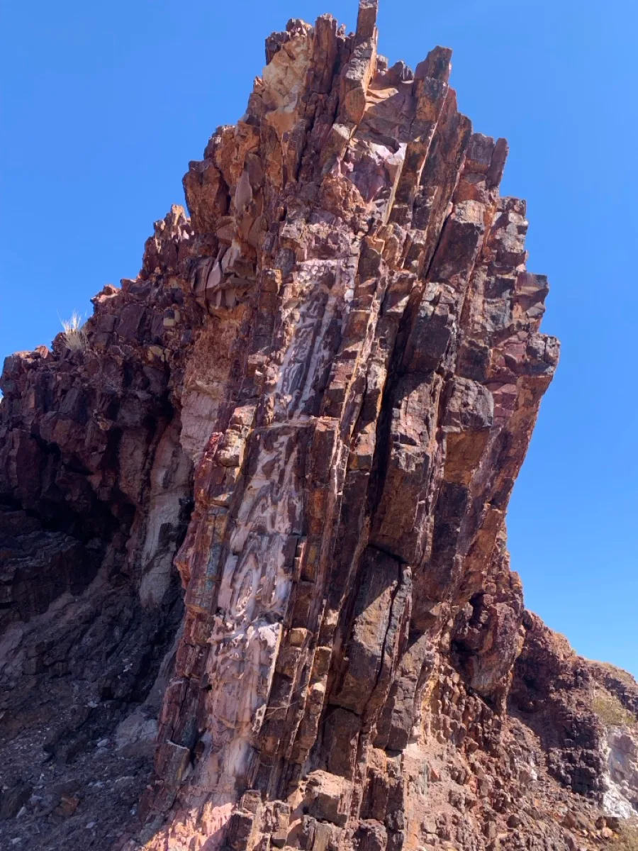 Majestic stone spire reaches toward the outback sky
