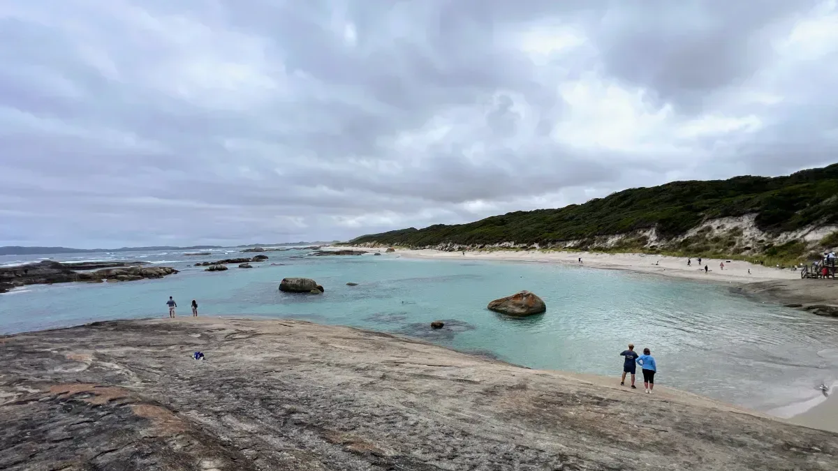 Even under a cloudy sky, Greens Pool remains a stunning sight, attracting visitors who come to admire its natural beauty. We're the 2 people looking at the view.