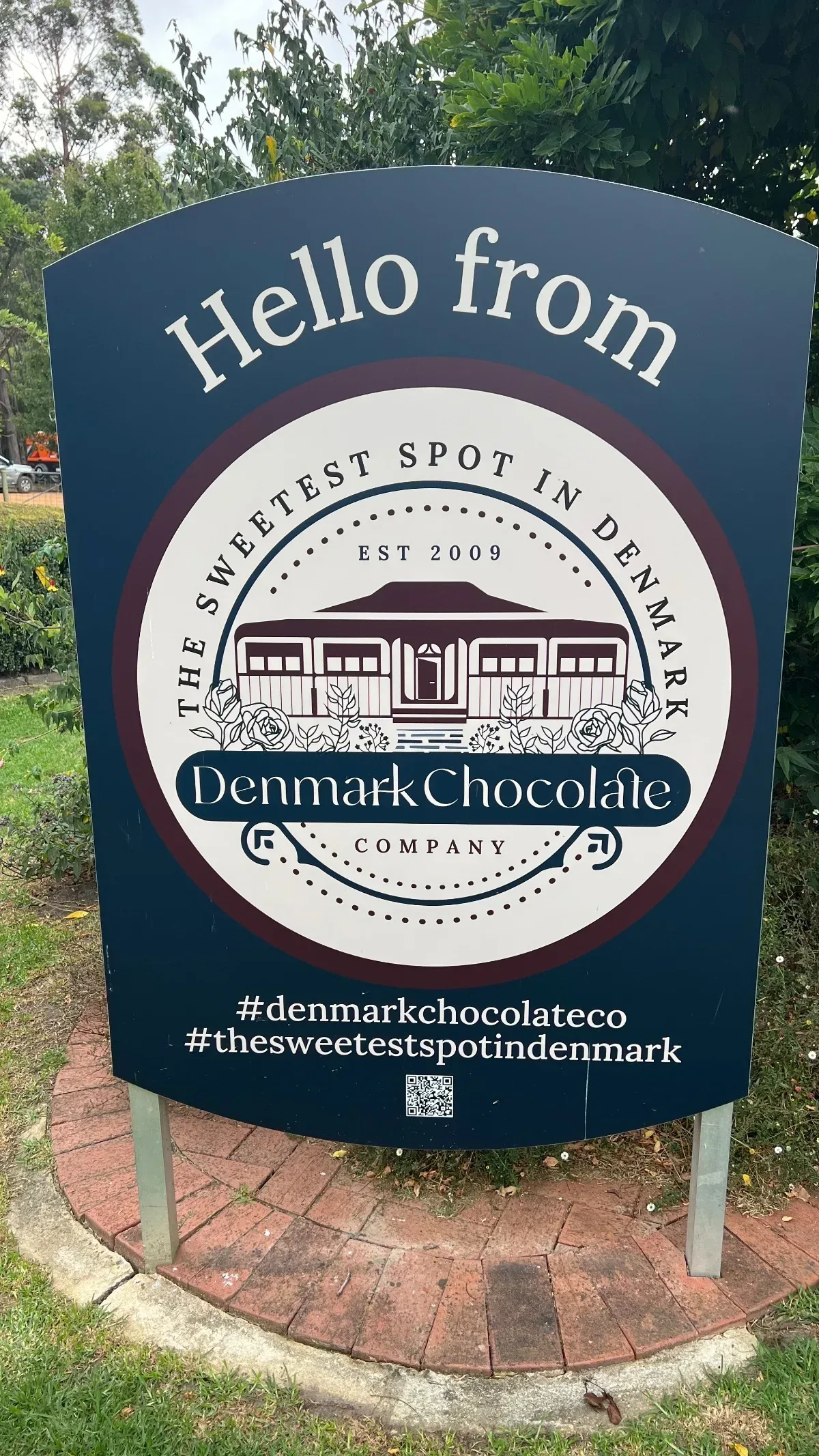 The sign welcoming visitors to Denmark Chocolate Company, proudly proclaiming it